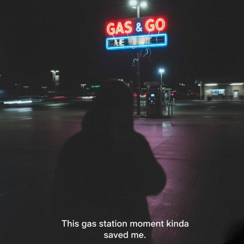 A shaky, off-center photo of a gas station's flickering neon "GAS & GO" sign at night, with a blurry shadow of a person in the foreground.