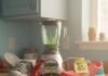 Healthy Lifestyle Inspiration: Easy Steps for a Happier You A cluttered kitchen counter with a leaking blender, an old sneaker, a new sneaker with a "You Got This!" sticky note, and a plastic dinosaur toy.
